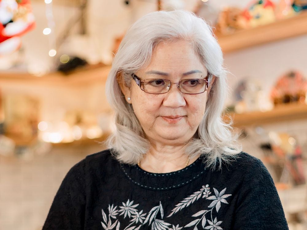 Cora Lindqvist, founder of Harbor & Heirloom, among the vintage finds in her shop